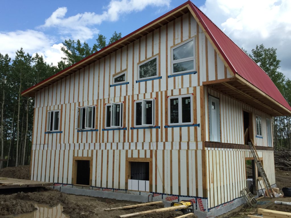Full Summer home bungalow energy efficient building envelope pre strapped for planking siding